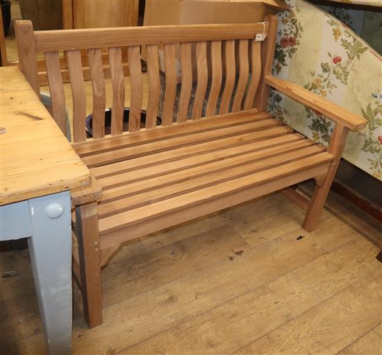 A modern teak garden bench W.130cm